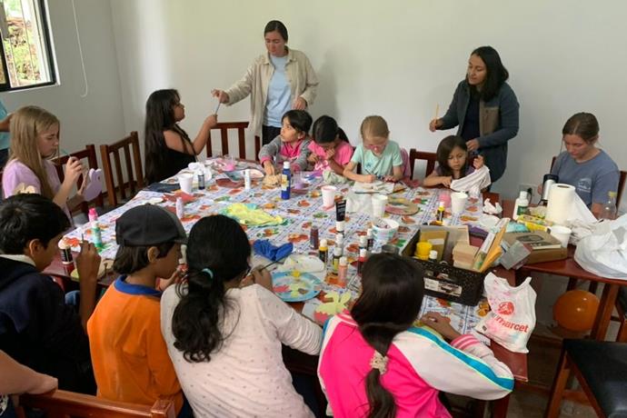 Delicia Bravo Aguilar (standing, right) led activities with children from the three Anabaptist conferences. They enjoyed craft activities and learned about having “Peace with God, Peace with myself and Peace with others. Photo by Peter Wigginton.