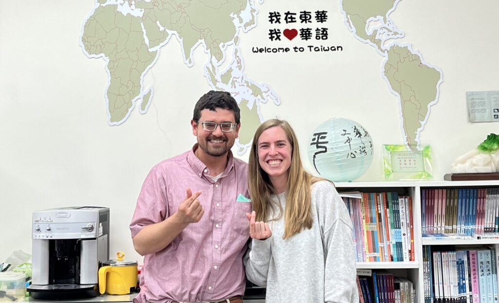 Caleb and Stephanie Schrock-Hurst pose with "finger hearts" (a popular Taiwanese photo gesture, like the peace sign) in the National Dong Hwa University Chinese Language Center office.