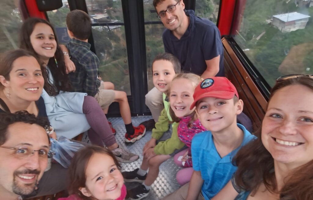 Laura's cousin, Amaris Allan, her husband, Stuart, and their children are pictured with the Sharp family on a cable car overlooking El Paraíso in south Bogotá on June 14, 2026. Their relatives were visiting from Pennsylvania. Photo by Laura Sharp.