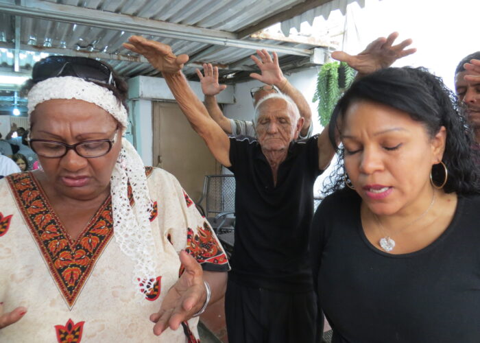 During prayer in a Caracas worship service