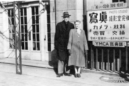 Genevieve and Ralph Buckwalter in front of a YMCA in Japan in 1950