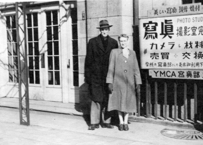 Genevieve and Ralph Buckwalter in front of a YMCA in Japan in 1950