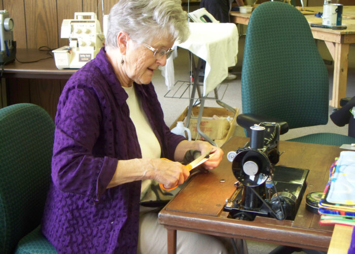 Phyllis Lind makes a fabric maze for people who are mentally and physically disabled. This project is part of her SOOP assignment at The Adaptation Center. Photo by Arloa Bontrager. Download full-resolution image.