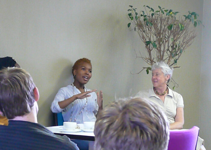 Slindile Thabede speaks during an Anabaptist Network in South Africa Dialogue in Cape Town. Lynn Pedersen is to Thabede's right. Dialogues occur in Cape Town and Johannesburg on a quarterly basis