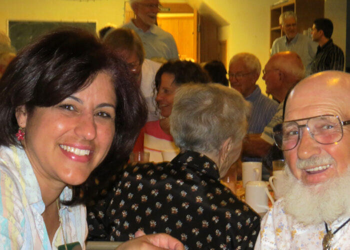 Madeline Maldonado and Herman Miller converse during the June 7 Africa Festival hosted by Mennonite Mission Network at Shalom Mennonite Church in Newton