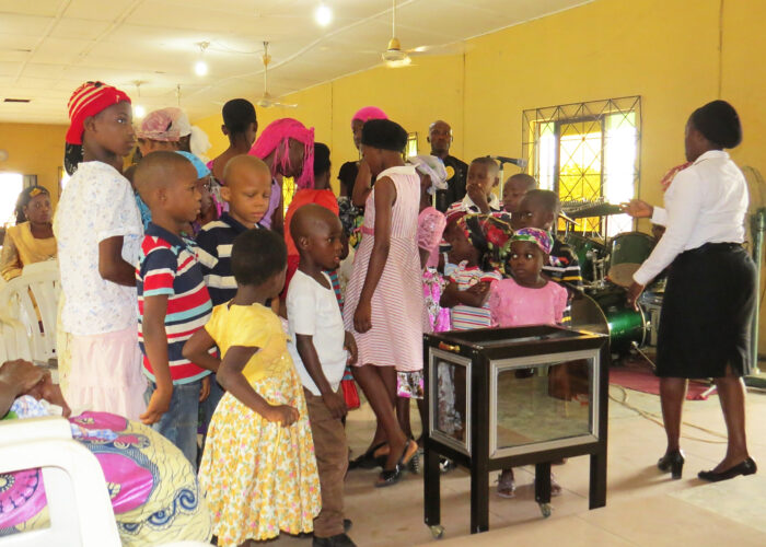 Children from the Mennonite Church Nigeria congregation in Uyo form a processional to give their offerings. Photographer: Lynda Hollinger-Janzen  Download full-resolution image.