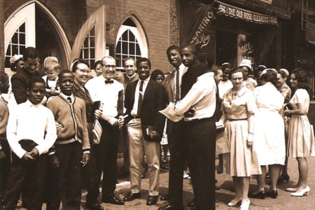 ​From left to right (in the middle of the picture) is the late Ethel M. Zeager (wearing a covering and glasses and holding a Bible)