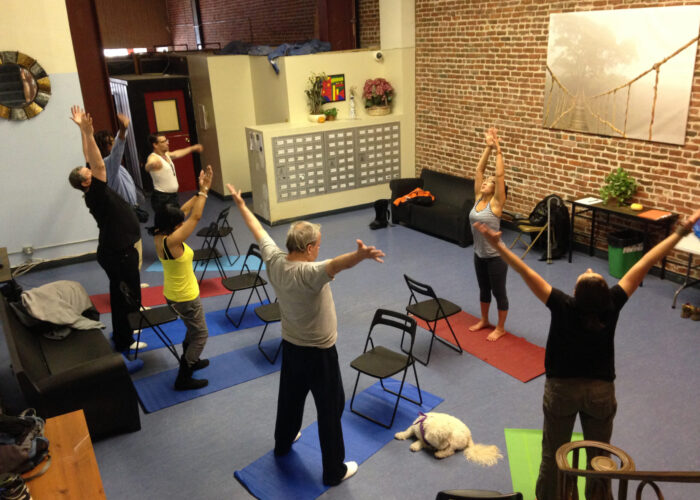DISH tenants exercise and relax together during an eight-week yoga class organized by Alyssa Schrag. Photo by Alyssa Schrag. Download full resolution image.