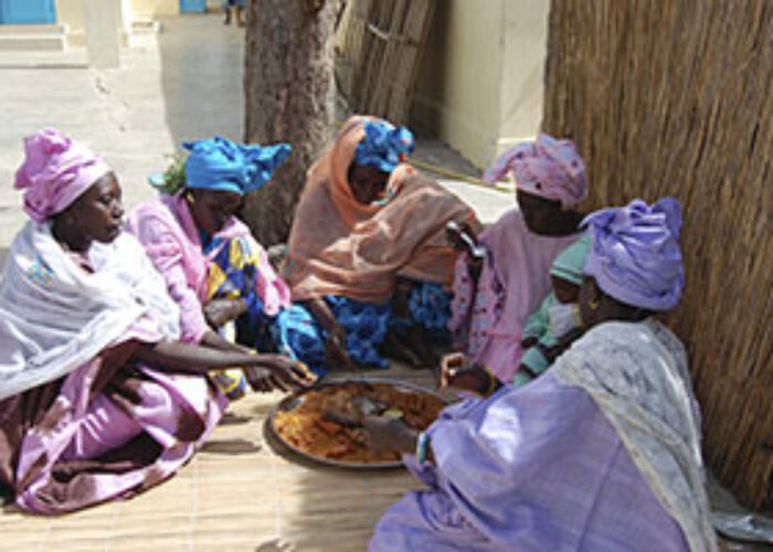 Wolof followers of Jesus share a meal during the women's day seminar in St. Louis