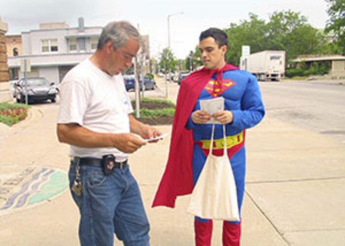 Mark McCain (left) talks to Nicholas Cloutier about an upcoming event