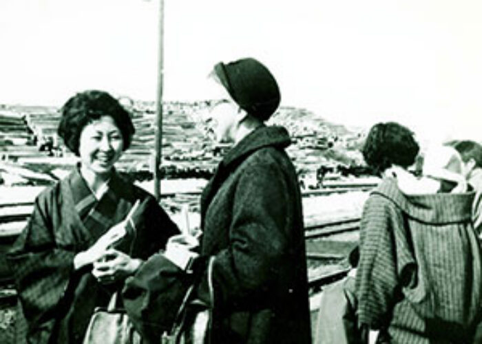 Rhoda Ressler (right) witnesses at a train station