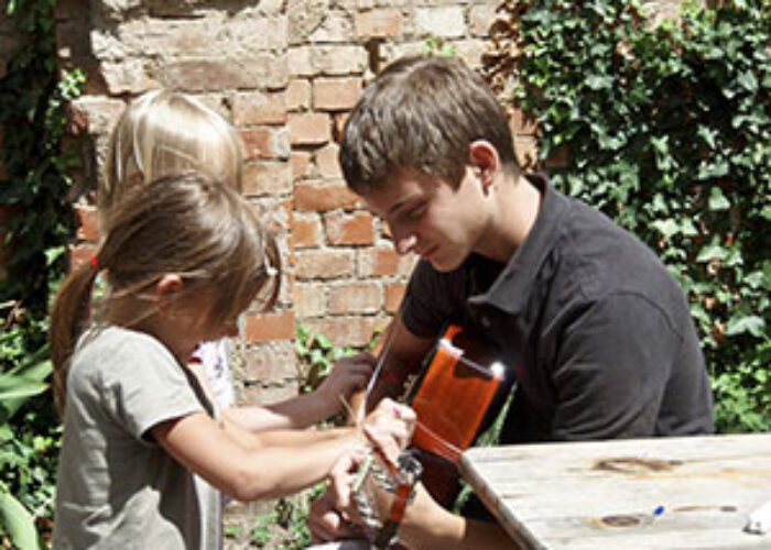 Dylan Pieri plays guitar with Stella and Vivian at Soli Deo in Halle