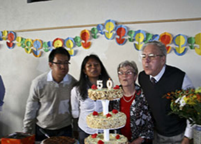 Salohy Rakotonindriana and Erika Kennel blow out candles.