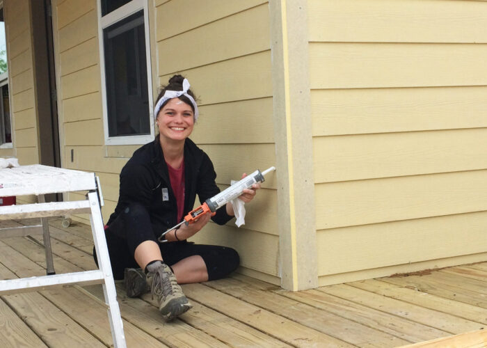Sara Schowalter from Colorado Springs service Adventure unit, caulking siding