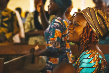 Blandine Daague worships in Benin. Photo by Josh Garber.