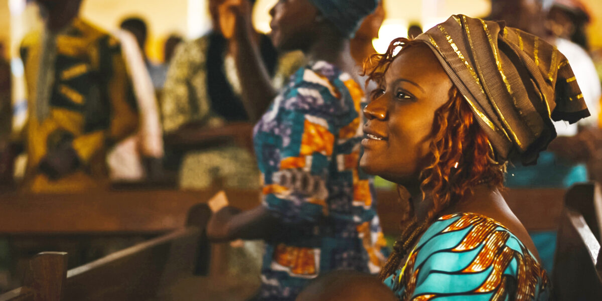 Blandine Daague worships in Benin. Photo by Josh Garber.