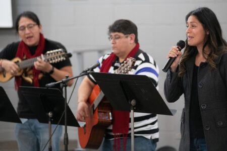 Mariela Sanchez (right) leads singing at Piedra Vida Mennonite Church