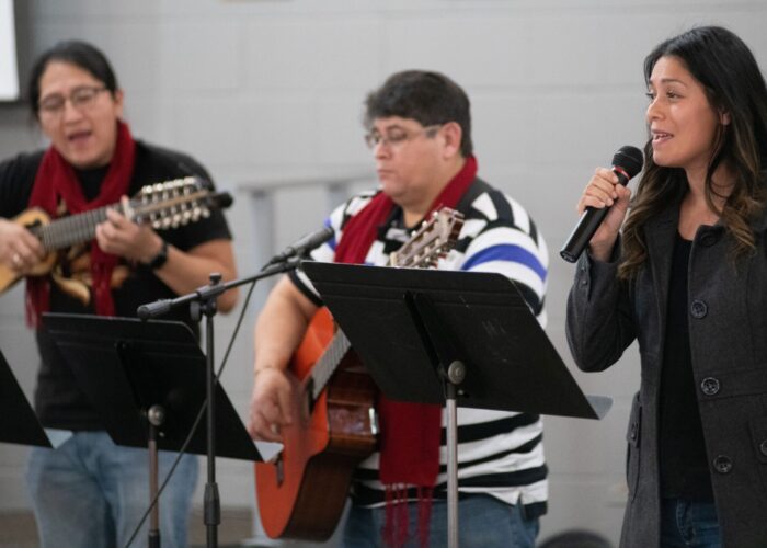 Mariela Sanchez (right) leads singing at Piedra Vida Mennonite Church