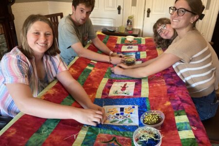 Each year, the San Francisco MVS unit is invited to gather together and craft comforters for themselves. Karen Kreider Yoder, a member of the unit's host congregation, First Mennonite Church of San Francisco, hosts the group at her home for this annual tradition. At the end of the day, each participant takes home their own cozy comforter to use during their service term and beyond! Left to right: Ana Neufeld Weaver, Keyan Krabill, Emmi Scott and Bella Kephart. Photo by Karen Kreider Yoder.