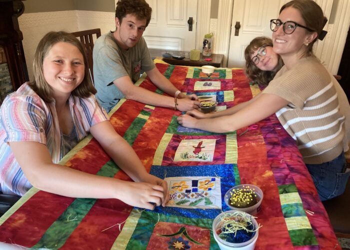 Each year, the San Francisco MVS unit is invited to gather together and craft comforters for themselves. Karen Kreider Yoder, a member of the unit's host congregation, First Mennonite Church of San Francisco, hosts the group at her home for this annual tradition. At the end of the day, each participant takes home their own cozy comforter to use during their service term and beyond! Left to right: Ana Neufeld Weaver, Keyan Krabill, Emmi Scott and Bella Kephart. Photo by Karen Kreider Yoder.