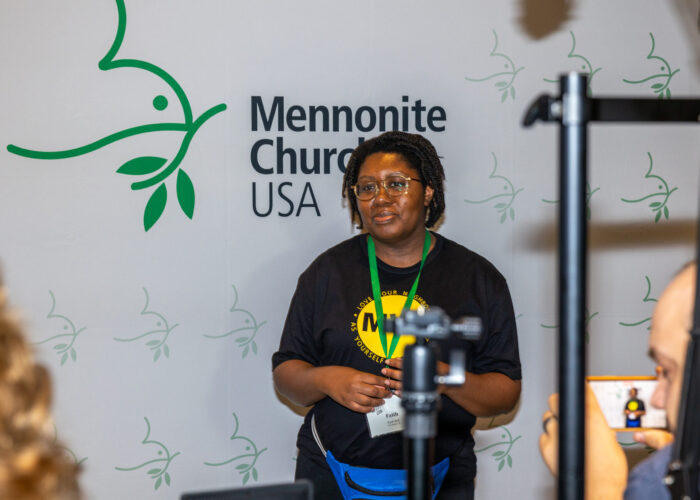 ​Faith Bell at the MC USA booth at MennoCon21. Photo by MC USA Communications.