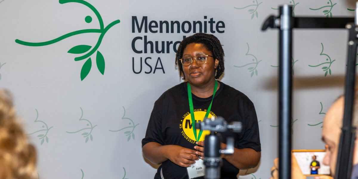​Faith Bell at the MC USA booth at MennoCon21. Photo by MC USA Communications.