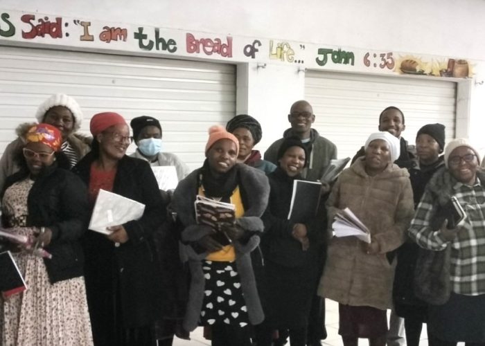 Reuben Mgodeli, Coordinator of Mission Network partner Mennonite Biblical Studies' program (left) is pictured with students who attended a recent class.