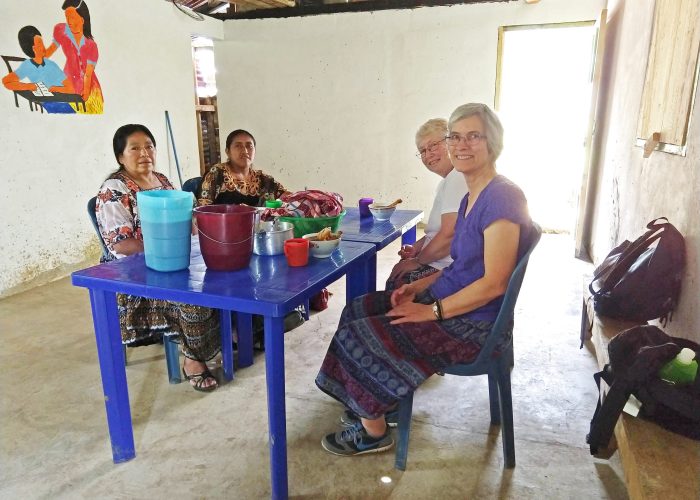 ​Left to right: Petrona Caz and Silvia Pop share a meal with Mission Network worker Deb Byler and Latin America area director Linda Shelly in the community of Oquebha