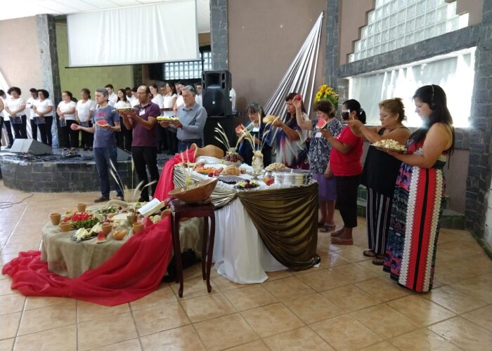 ​Brothers and sisters of the Mennonite churches from across the Southern Cone of South America pray together prior to sharing in communion
