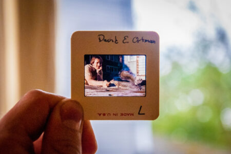 ​David Ortman feeds a squirrel outside the unit house in one of the many slides present at the MVS Seattle celebration. Ortman was an MVS Seattle participant 1975-1977 and 1978-1980. Photo by Greg Thiessen.