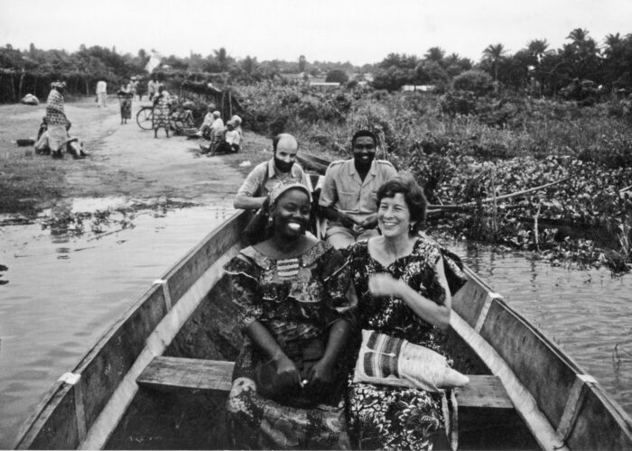 From back left, Daniel Goldschmidt-Nussbaumer, a Mennonite Board of Missions doctor from France, and Saturnin Afaton, a Beninese lawyer. From front left, Rebecca Assani, an Apostolic Church educator, and Lynda Hollinger-Janzen begin a river crossing in a pirogue (dugout canoe) during a community health trip to Gbeko in 1987.