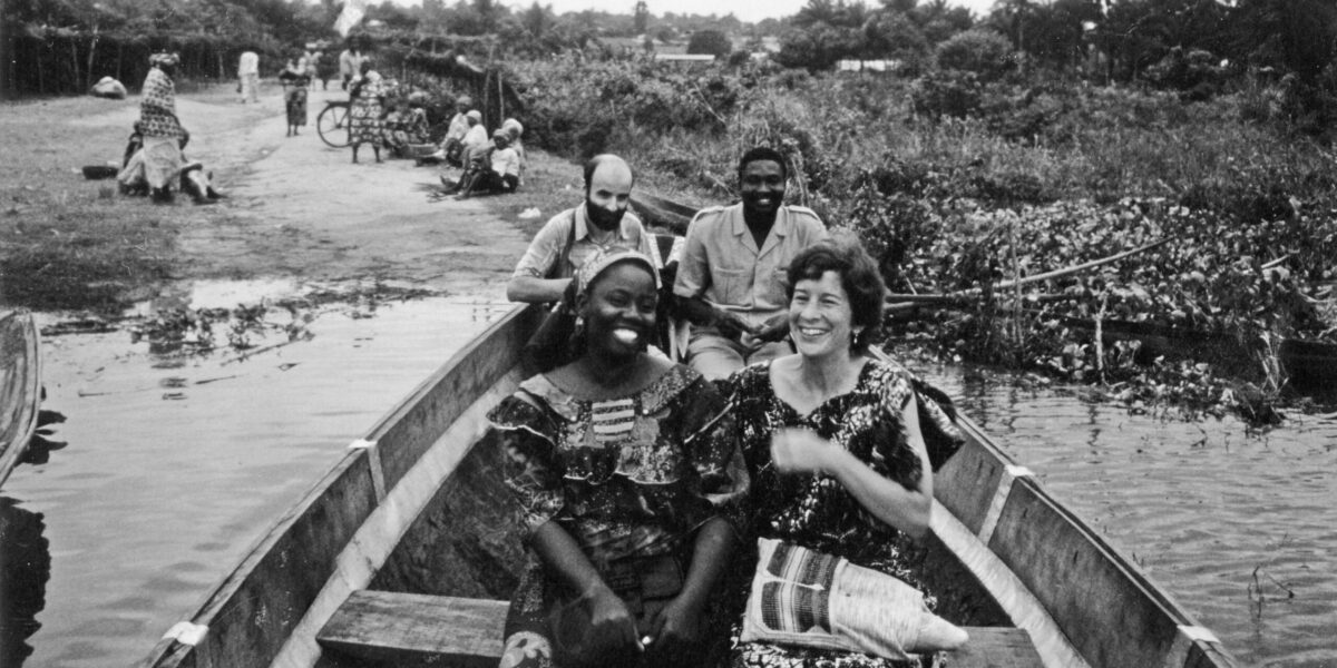 From back left, Daniel Goldschmidt-Nussbaumer, a Mennonite Board of Missions doctor from France, and Saturnin Afaton, a Beninese lawyer. From front left, Rebecca Assani, an Apostolic Church educator, and Lynda Hollinger-Janzen begin a river crossing in a pirogue (dugout canoe) during a community health trip to Gbeko in 1987.