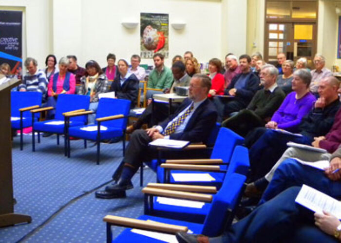 Dennis Byler speaks to a crowd