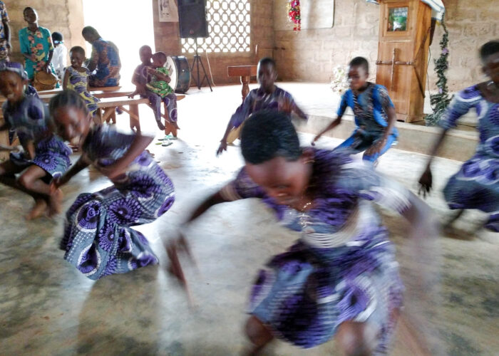 ​​Children dance during a worship service at La Casa Grande