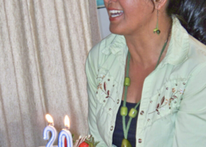 Download high-resolution photoPatricia Urueña sings as she presents a cake celebrating the 20th anniversary of Mennonites in Ecuador. (Photo by Kevin Goertzen)