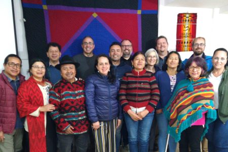 Partnership in front of the partnership quilt made of Ecuadorian fabric, sewn by CPMC people. ICAME with Partnership: Julián Guamán, Elsa Yantalema, Oscar Herrera, Gerónimo Yantalema, Joel Beachy, Daniela Sánchez, Diego Castro, Nathan Luitjens, Margarita de la Torre, Linda Shelly, Andrew Suderman, Alba Silva, Alexandra Meneses, Peter Wigginton, Arianne Isturiz