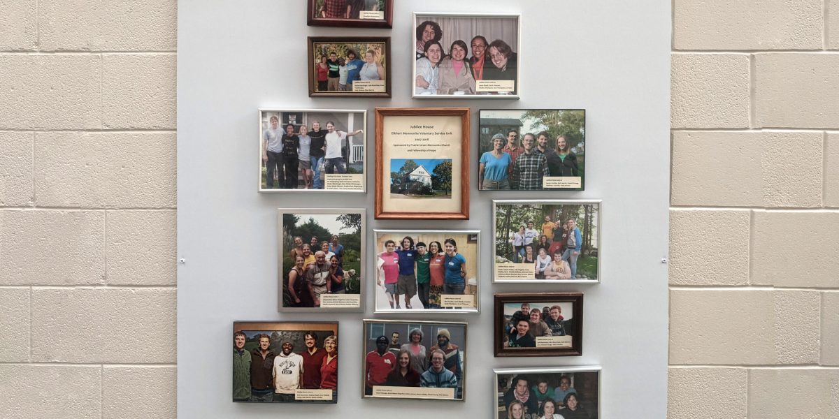 ​Photos of the MVS unit participants hang in a foyer at Prairie Street Mennonite Church. Photo by Zachary Headings.