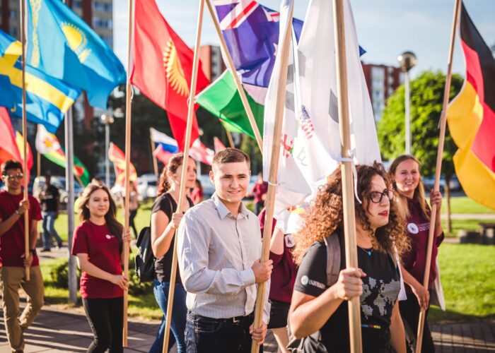 LCC students carry flags to represent their home countries.