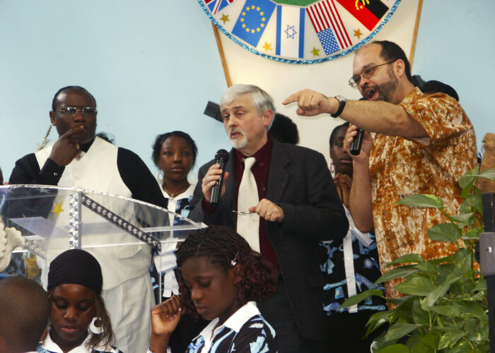​Stanley Green (right) delivered greetings and proclaimed our oneness in Christ to the Assemblée Evangélique Le Rocher (Evangelical Church of the Rock)