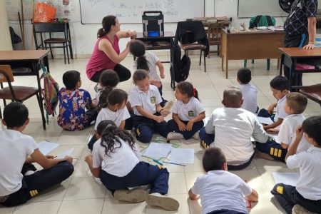 Laura Sharp prepares an educational video to teach English question words who, what, when, where, why and how. Photo by Nick Sharp.