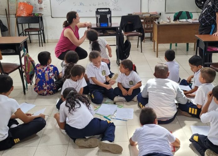 Laura Sharp prepares an educational video to teach English question words who, what, when, where, why and how. Photo by Nick Sharp.