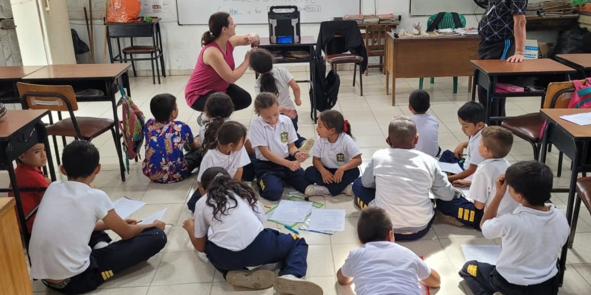 Laura Sharp prepares an educational video to teach English question words who, what, when, where, why and how. Photo by Nick Sharp.