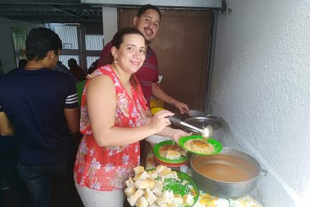 ​Helena Mirabal and Victor Mendez serve food for everyone after a service at the Mennonite church in El Paraíso neighborhood of Caracas in Venezuela. The church also shares food with their broader community