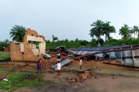 ​Children from Ndjoko Punda observe the damage to the Mennonite church caused by the Nov. 22 storm. Photo provided.