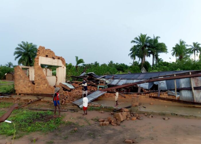 ​Children from Ndjoko Punda observe the damage to the Mennonite church caused by the Nov. 22 storm. Photo provided.