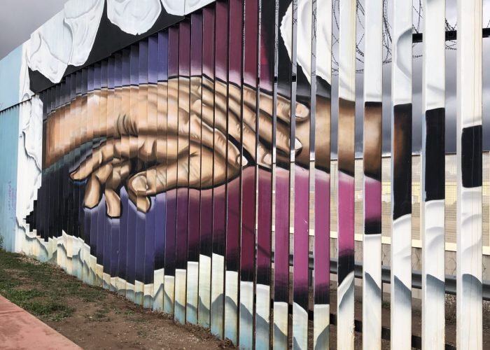 ​A mural on the Mexico side of the border wall between Agua Prieta