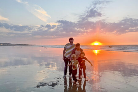 The Givens family enjoy an evening on the Calais, France, beach. This place of renewal is also a place of death for many people seeking a better life. Photographer: Joseph Givens.