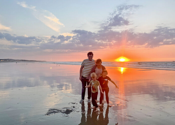 The Givens family enjoy an evening on the Calais, France, beach. This place of renewal is also a place of death for many people seeking a better life. Photographer: Joseph Givens.