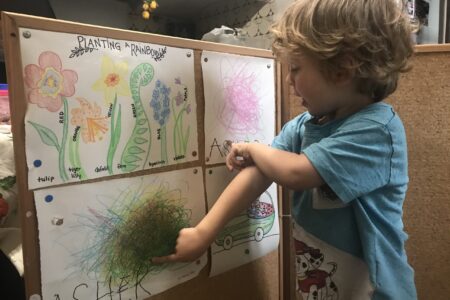 Asher Garber comments on his homeschool artwork during Barcelona’s lock-down due to COVID-19. Photo by Alisha Garber.