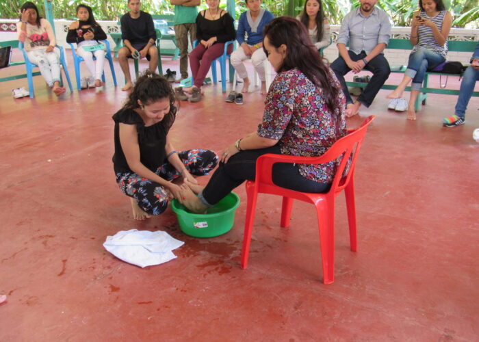 ​Lilibeth Guzman washes Andrea Castro Serrano's feet. Photo by Kelly Frey Martin.